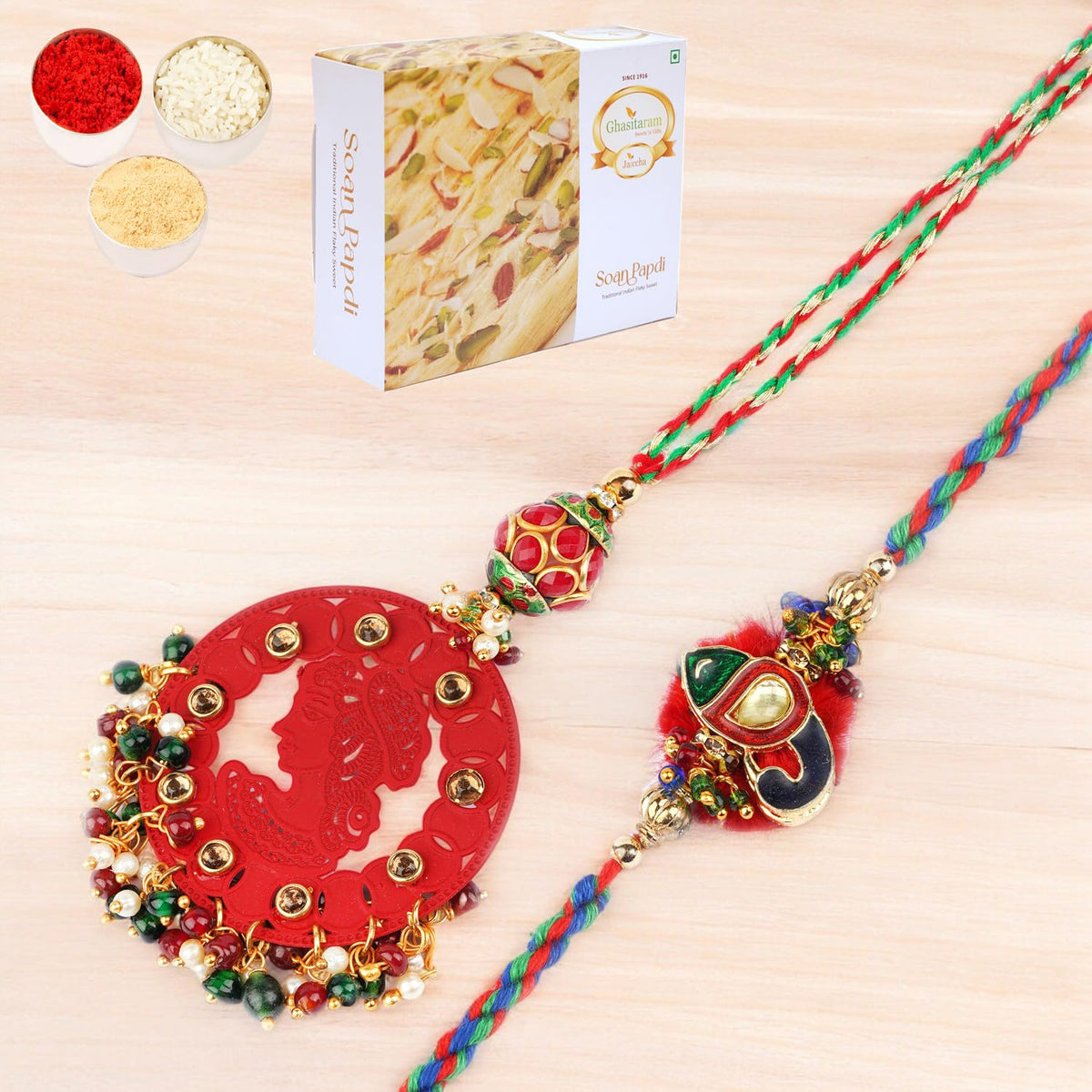 Ghasitaram Gifts Rakhi for Brother Rakhis Online - RM-140 Bhaiya Bhabhi Rakhi with 200 GMS of Soan Papdi