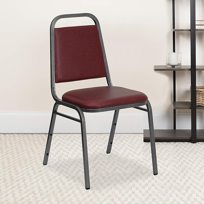 EMMA + OLIVER Trapezoidal Back Vinyl Stackable Banquet Chair, Multipurpose Stacking Chair with Padded Seat and Back, Burgundy/Silver